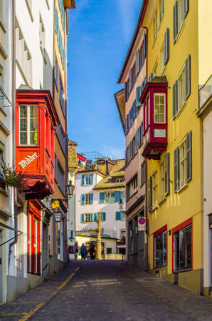 ZURICH, SWITZERLAND, OCTOBER 24, 2015: View of a narrow street winding through the historical center of zurich in switzerlandのeditorial素材