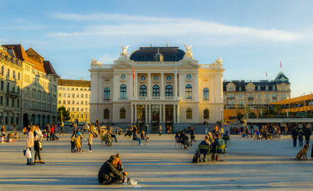 ZURICH, SWITZERLAND, OCTOBER 24, 2015: People are passing by Sechsenlautenplatz in the swiss city zurich which is dominated by the majestic building of opera.のeditorial素材