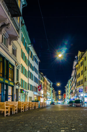 ZURICH, SWITZERLAND, OCTOBER 25, 2015: Cobbled pedestrian street Rennweg in Zurich during night, Switzerland.のeditorial素材
