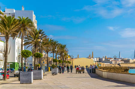 CADIZ, SPAIN, JANUARY 6, 2016: people are walking on a seaside promenade in cadizのeditorial素材