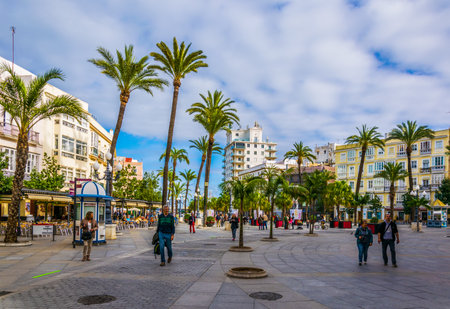 CADIZ, SPAIN, JANUARY 6, 2016: people are strolling over the square of saint john of god in cadizのeditorial素材