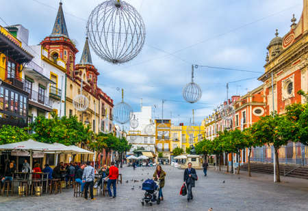 SEVILLA, SPAIN, JANUARY 7, 2016: people are strolling on the plaza del salvador in the spanish city sevillaのeditorial素材