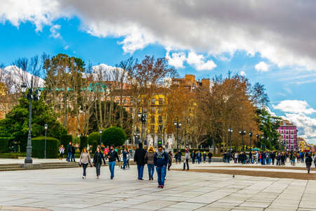 MADRID, SPAIN, JANUARY 9, 2016: People are walking on a street next to the royal palace in madrid