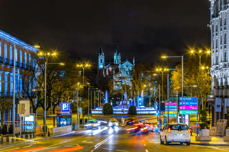 MADRID, SPAIN, JANUARY 9, 2016: night view of the illuminated plaza de las cortes with neptun fountain in madridのeditorial素材