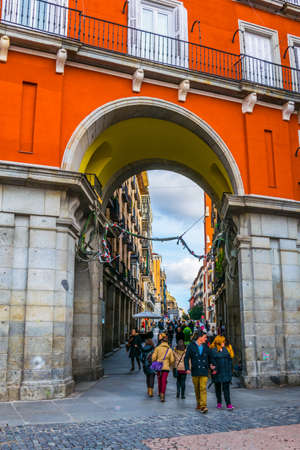 MADRID, SPAIN, JANUARY 9, 2016: people are strolling under an arcade of the plaza mayor square in the spanish capital madridのeditorial素材