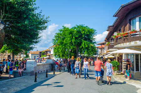 NESEBAR, BULGARIA, JULY 17, 2015: People are strolling during sunny summer day through streets of bulgarian city nesebar which belongs to the unesco world heritage.のeditorial素材