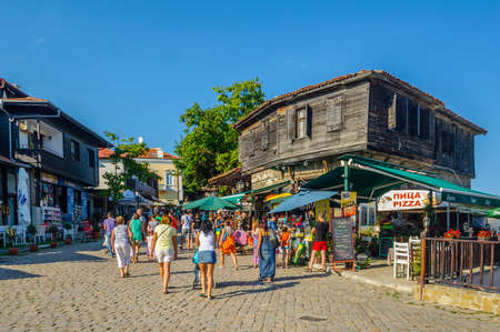 SOZOPOL, BULGARIA, JULY 17, 2015: The streets of the old city resort of Sozopol in Bulgaria are full of tourist during summer. Old town is famous for its distinctive wooden architecture, typical for bulgarian medieval age.のeditorial素材