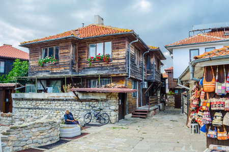 NESEBAR, BULGARIA, JULY 17, 2015: People are strolling during sunny summer day through streets of bulgarian city nesebar which belongs to the unesco world heritage.のeditorial素材