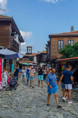 NESEBAR, BULGARIA, JULY 17, 2015: People are strolling during sunny summer day through streets of bulgarian city nesebar which belongs to the unesco world heritage.のeditorial素材