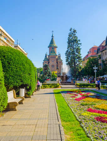 TIMISOARA, ROMANIA, JULY 4, 2015: Victory square - piata victoriei - timisoara is a long square with green park surrounded by national opera on one side and the metropolitan cathedral on the other.のeditorial素材