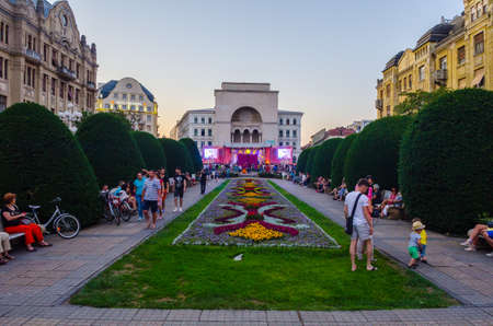 TIMISOARA, ROMANIA, JULY 4, 2015: Sunset over Victory square - piata victoriei - timisoara. During night this square center of nightlife in the city is often hosting cultural events during summer seasonのeditorial素材