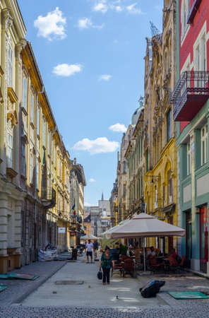 TIMISOARA, ROMANIA, JULY 4, 2015: People are strolling through narrow streets of the old town of Timisoara in romania, which is well preserved city close to hungary.のeditorial素材