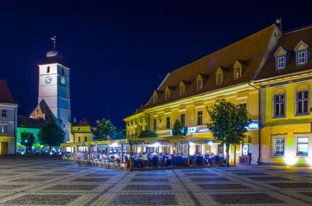 SIBIU, ROMANIA, JULY 6, 2015: night view of the illuminated Big Square - piata mare with its majestic city hall in romanian city sibiuのeditorial素材