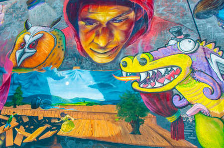 PLOVDIV, BULGARIA, APRIL 7, 2015: grafitti painted on a wall in bulgarain city plovdiv shows puppets playing various characters in a puppet theater.のeditorial素材