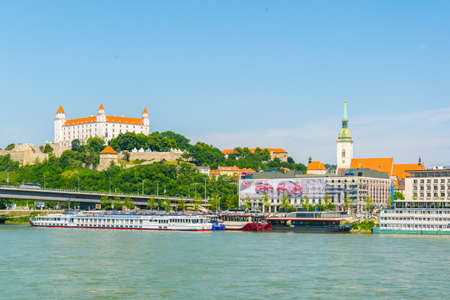 BRATISLAVA, SLOVAKIA, MAY 28, 2016: View of the cathedral of saint martin and Bratislava Castle over danube river in Slovakiaのeditorial素材