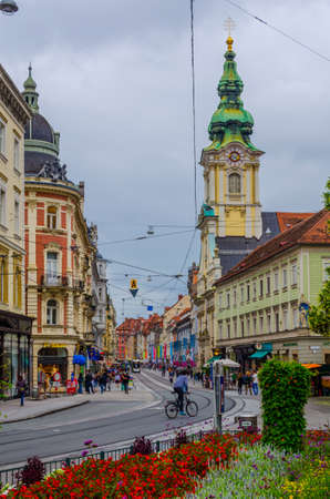 GRAZ, AUSTRIA, JULY 30, 2015: Street view of Herrengasse in the Old City of Graz near Stadtpfarrkirche in Austria in January