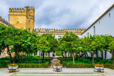 CORDOBA, SPAIN, JANUARY 8, 2016: people are strolling through an inner courtayrd of the alcazar de los reyes cristianos - royal palace of the cristian kings in the spanish city cordobaのeditorial素材