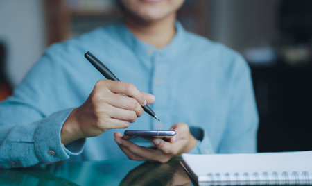 businessman, man using pen, electronic signing, paperless, on screen, phone, online,の写真素材