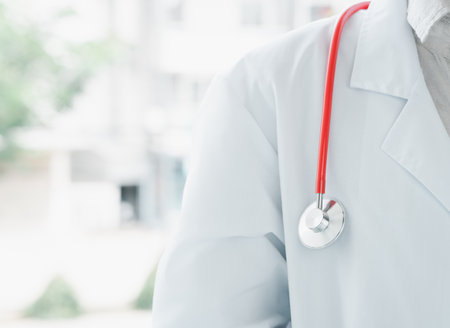 Doctor, stethoscope attached to neck, copy-space, blurry background, nonexistent, close-up, concept, pulmonary, or cardiac.の写真素材
