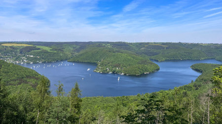 View over the Rur-Lake in the Eifel in Germany - Blue and Green for summer Vacationの写真素材