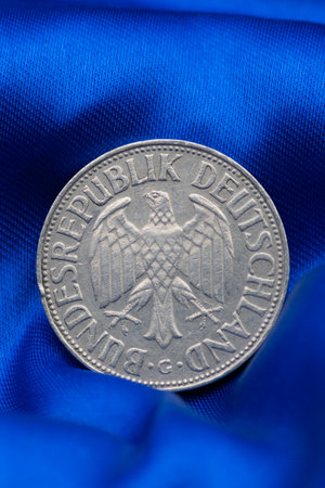 High Quality Macro of a Deutsche Mark Coin on Blue Background to sho Germany in the European Unionの写真素材