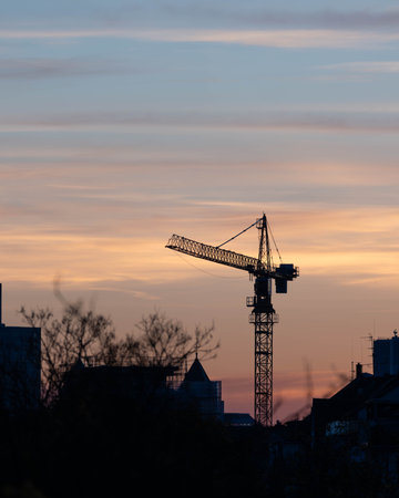 Crane in the Sunset of Duesseldorf Germany in November 2025 - City Developementの写真素材