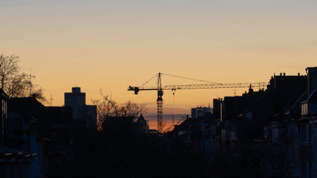Crane in a Sunset of Duesseldorf Germany in November 2025 - City Developmentの写真素材