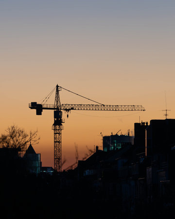 Crane in a Sunset of Duesseldorf Germany in November 2025 - City Developmentの写真素材