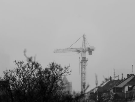 Crane in the foggy Sunset of Duesseldorf in Black and White Germany in November 2025 - City Developementの写真素材