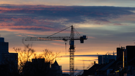 Crane in the Sunset of Duesseldorf Germany in November 2025 - City Developmentの写真素材