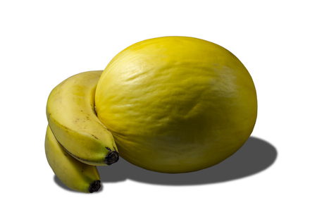 Delicious juicy yellow melon and bananasの写真素材