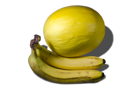 Delicious juicy yellow melon and bananasの写真素材