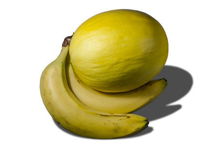 Delicious juicy yellow melon and bananasの写真素材