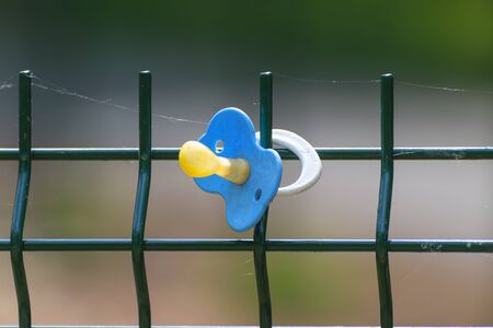 Baby nipple on the fence