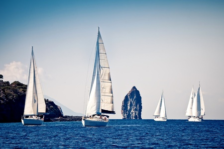 Sailing ship yachts with white sailsの写真素材