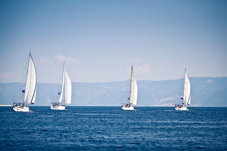 Sailing ship yachts with white sailsの写真素材