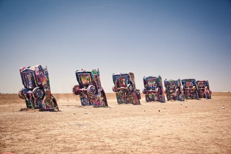 AMARILLO, TEXAS - JULY 10: Famous art installation of the old Cadillac cars on July 10, 2011 at Cadillac Ranch near Amarillo, Texas. It was created in 1974 by Chip Lord, Hudson Marquez and Doug Michels, who were a part of the art group Ant Farmのeditorial素材