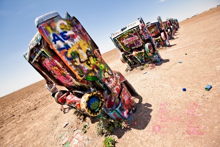 AMARILLO, TEXAS - JULY 10: Famous art installation of the old Cadillac cars on July 10, 2011 at Cadillac Ranch near Amarillo, Texas. It was created in 1974 by Chip Lord, Hudson Marquez and Doug Michels, who were a part of the art group Ant Farmのeditorial素材