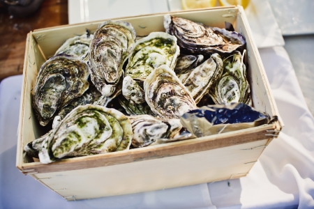 Fresh oysters on ice at an outdoor cafe 