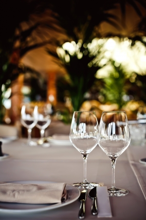 Empty glasses set in restaurantの写真素材