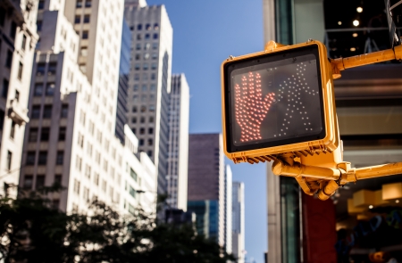 Don't walk New York traffic sign with illuminated and blurred backgroundの写真素材