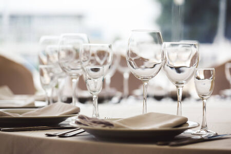Empty glasses set in restaurant. Part of interior