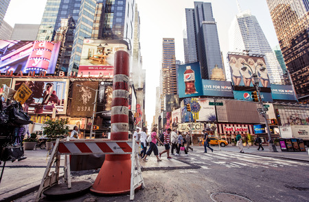 NEW YORK CITY - AUGUST 13: Times Square, is a busy tourist intersection of neon art and commerce and...