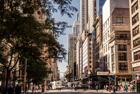 NEW YORK CITY - AUGUST 13: Yellow taxis rides on 5th Avenue on August 13, 2013 in New York, USA. 5th Avenue is a central road of Manhattan, the most expensive shops and apartmens situated here のeditorial素材