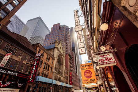 NEW YORK CITY - AUGUST 13: Times Square, is a busy tourist intersection of neon art and commerce and is an iconicplace of New York City and USA on August 13, 2013 in Manhattan, New York City.のeditorial素材