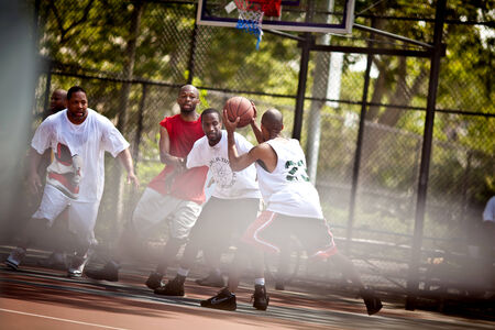 BROOKLYN, NEW YORK - JULY 2, 2011: Street basketball players on the basketball court on July 2, 2011, Brooklyn, USAのeditorial素材