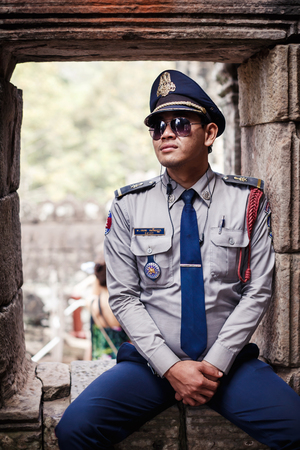 ANGKOR WAT,CAMBODIA - DECEMBER 31: Cambodian Police officer at Angkor Wat temple on December...