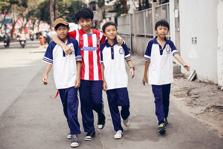 Unidentied boys walking on street in Ho Chi Minhのeditorial素材