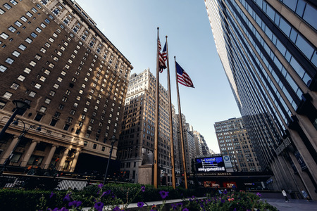 NEW YORK, UNITED STATES - SEPTEMBER 10: Typical below view from street on famous skyscrapers on...