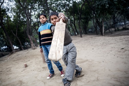 AGRA, INDIA - JANUARY 8, 2015: Little Indian boy playing game on January 8, 2015 in Agra, Indiaのeditorial素材